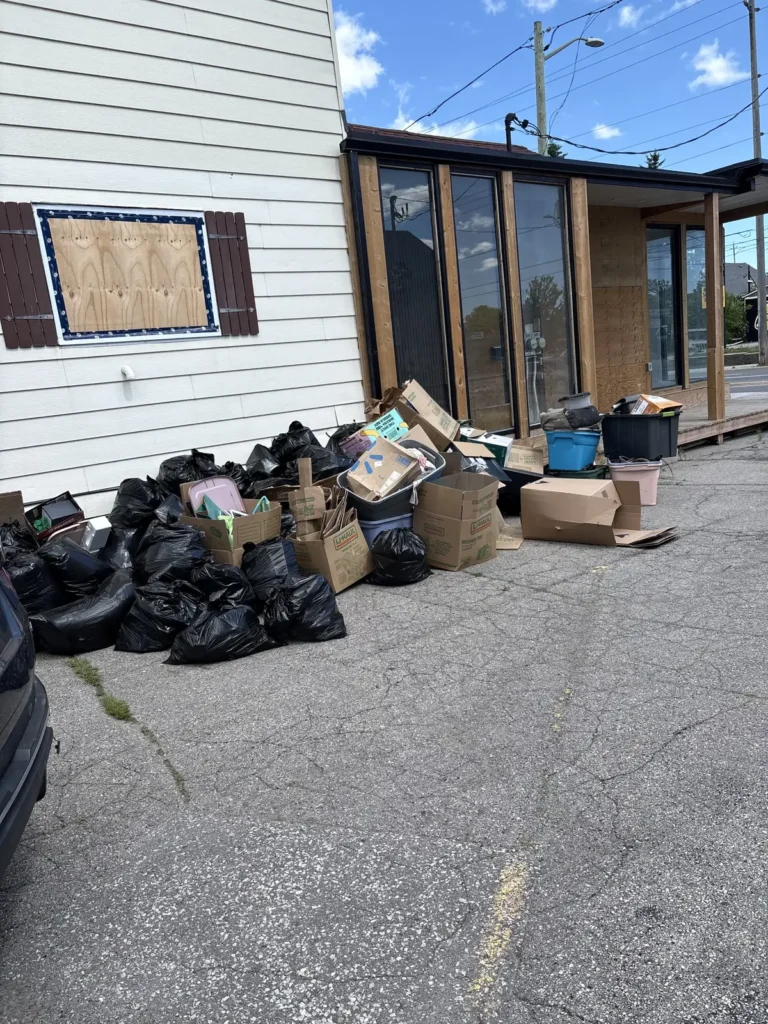 Junk removal Pickering property cleanout — bagged debris and boxes ready for pickup
